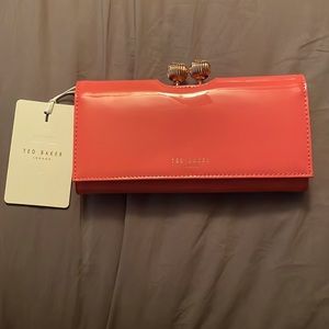 NWT Ted Baker London coral wallet with kiss lock.